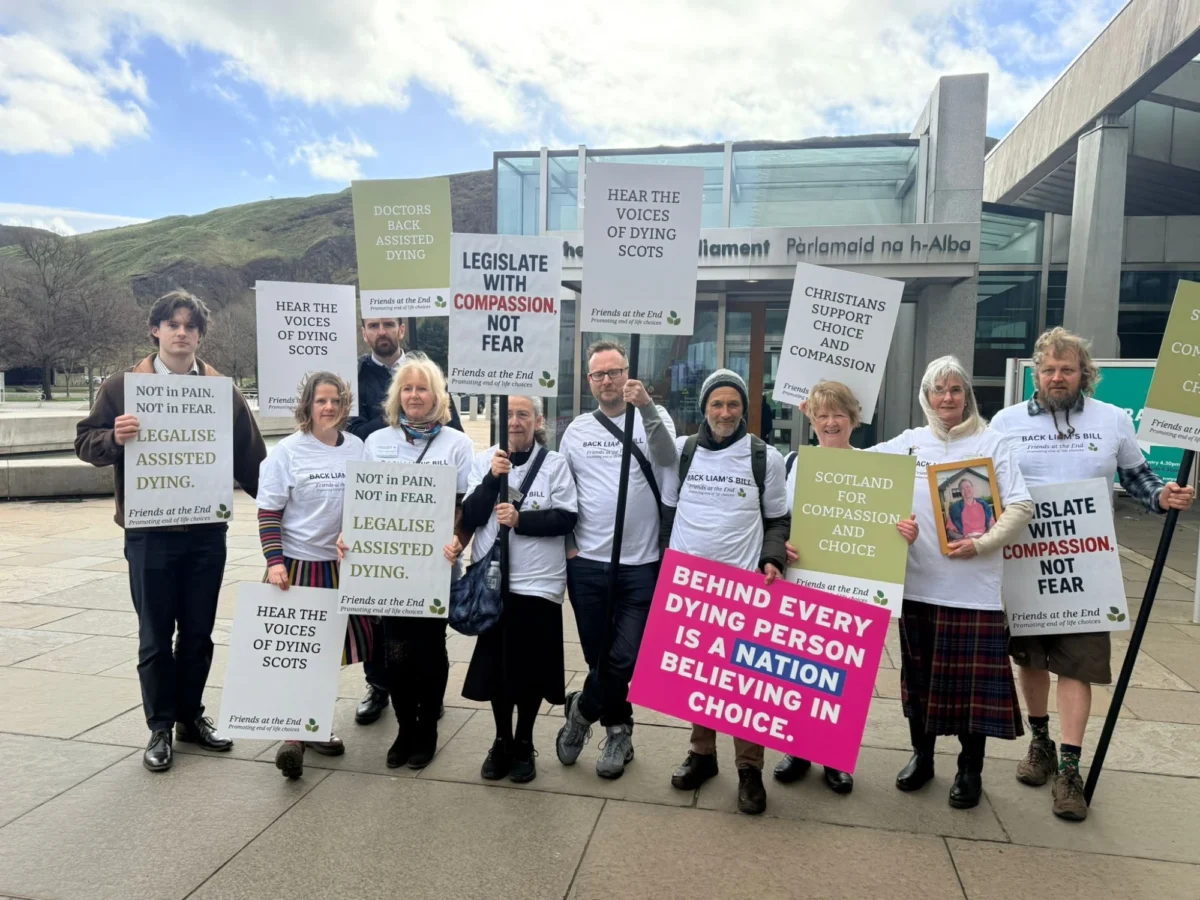 Friends at the End supporters with placards outside the Scottish Parliament