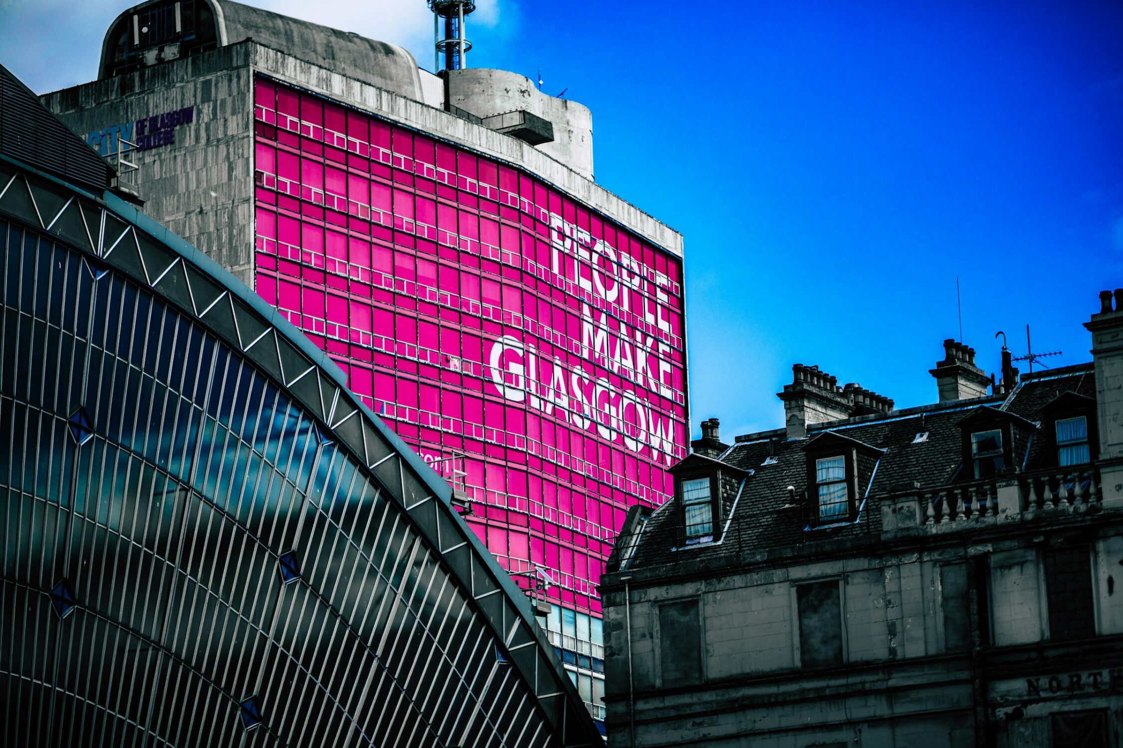 A Glasgow building with a People Make Glasgow banner