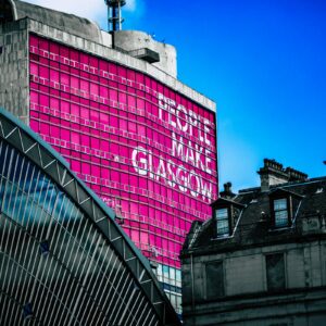 A Glasgow building with a People Make Glasgow banner