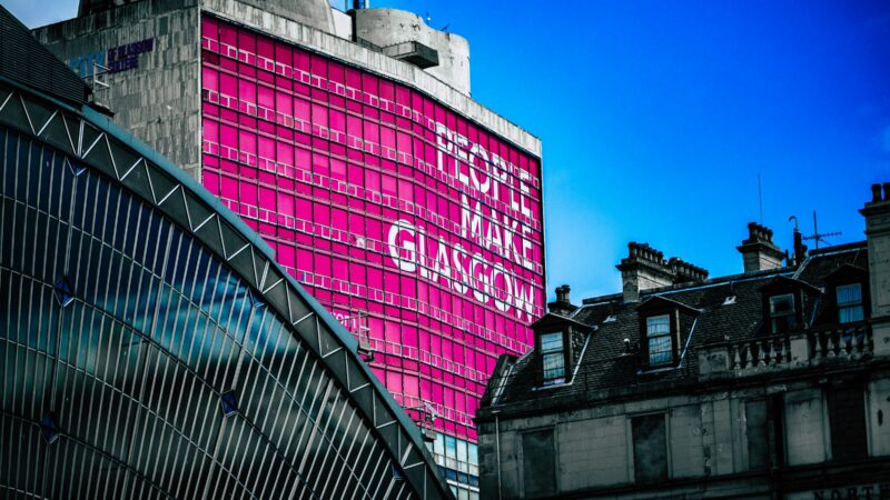 A Glasgow building with a People Make Glasgow banner