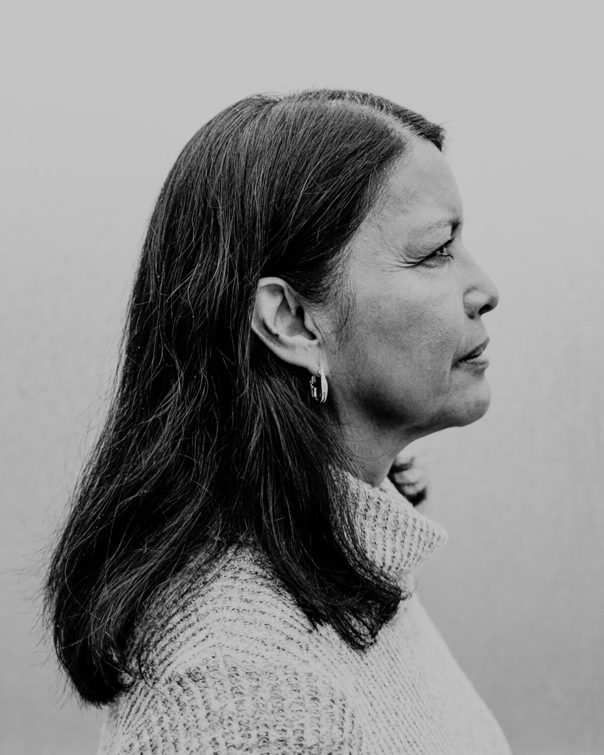 A woman in profile, in black and white
