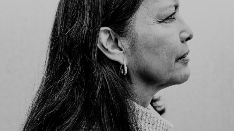 A woman in profile, in black and white
